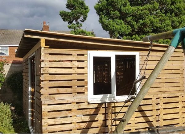 A Garden Shed Made From Wooden Pallets