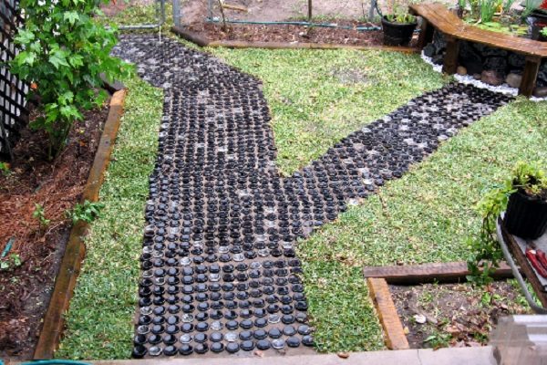 A Garden Path Made With Glass Bottles