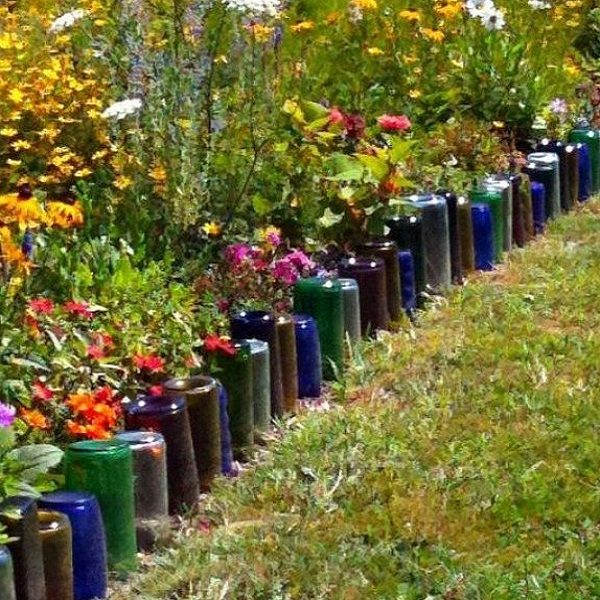 A Garden Border Made From Glass Bottles