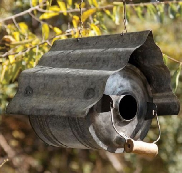 An Old Oil Can Used to Make a Birdhouse